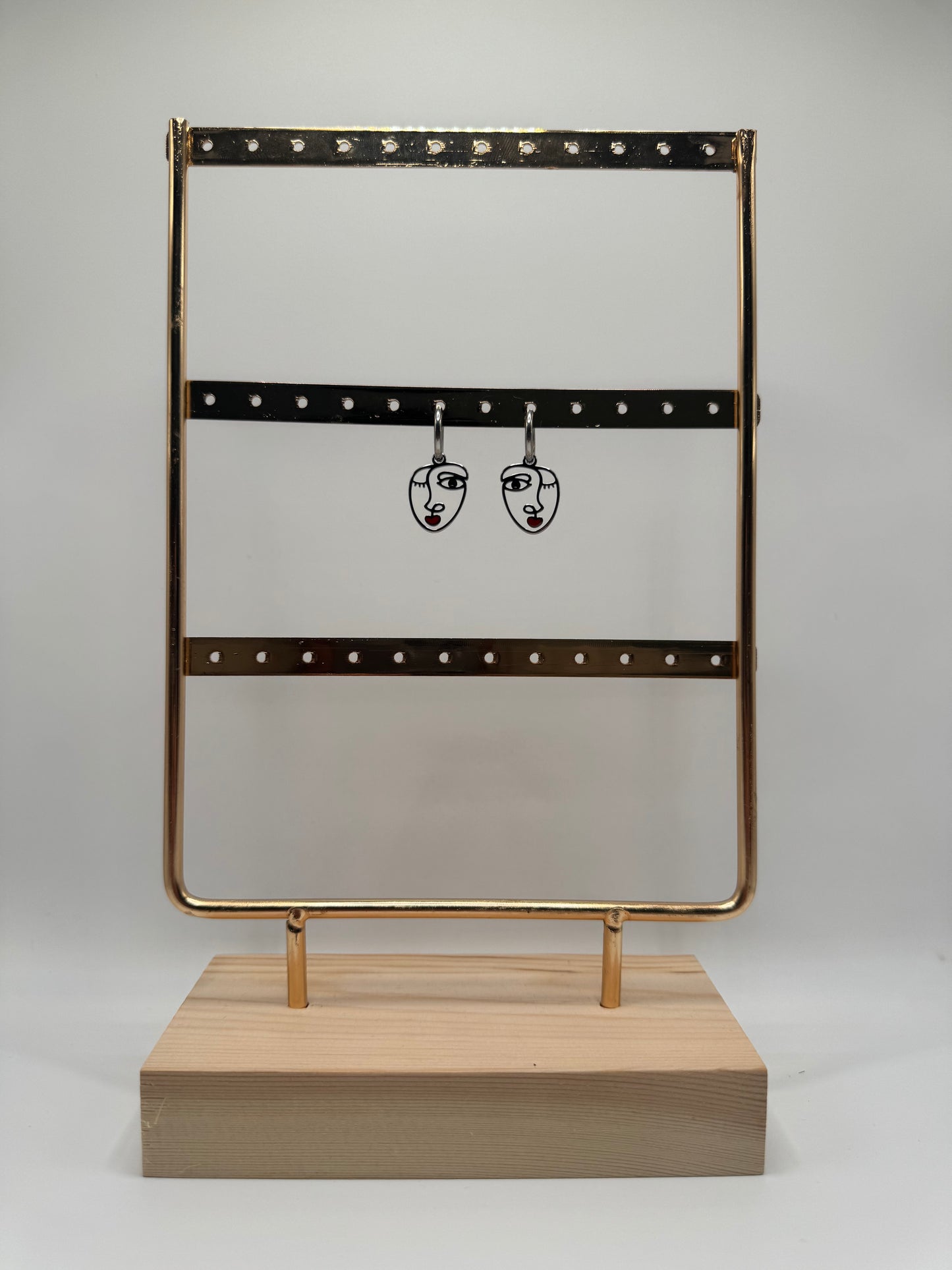 ORECCHINI PENDENTI VOLTO ACCIAIO