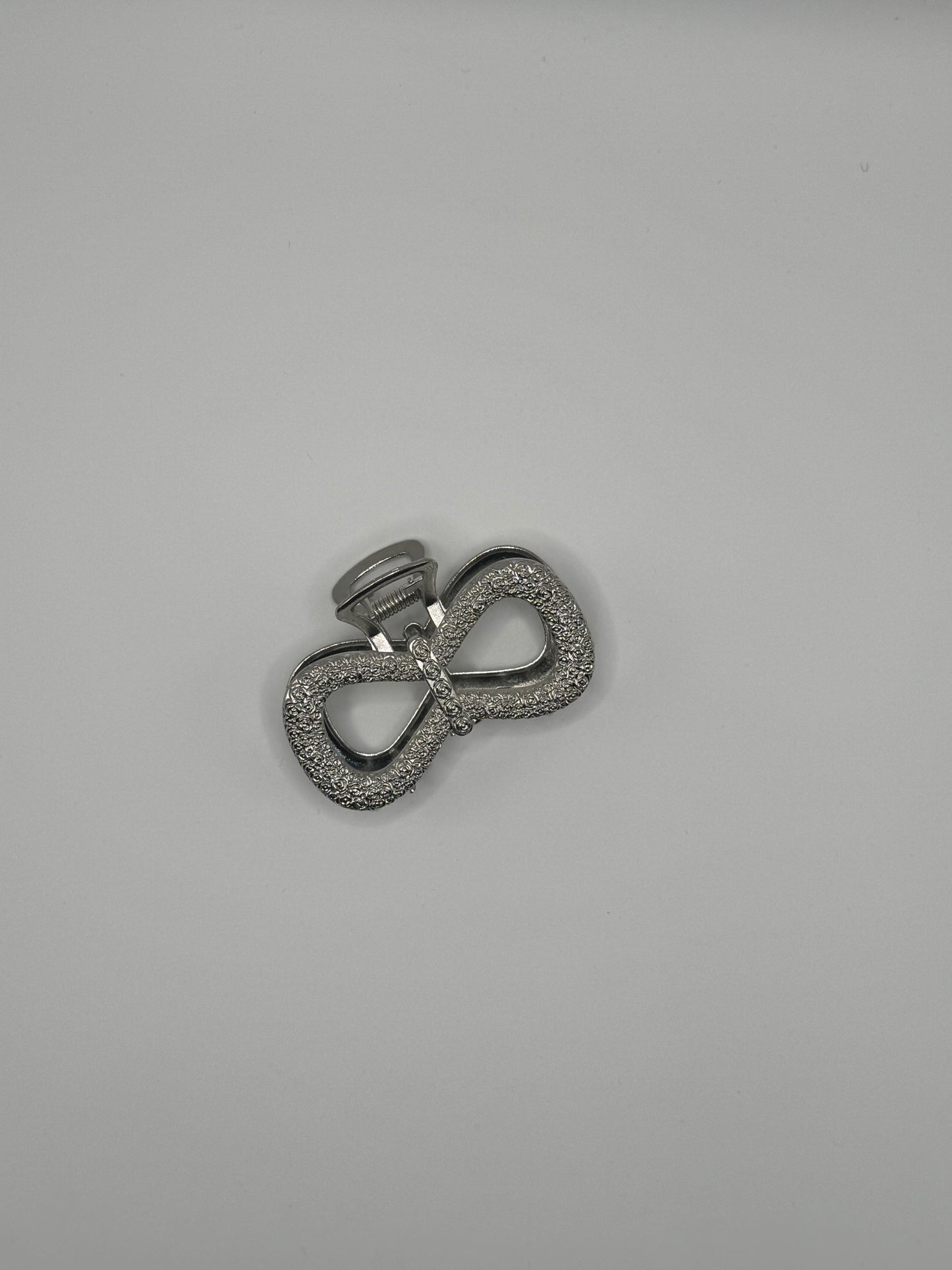 PINZA GRANDE A FORMA DI FIOCCO ARGENTO