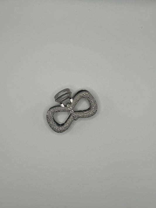 PINZA GRANDE A FORMA DI FIOCCO ARGENTO