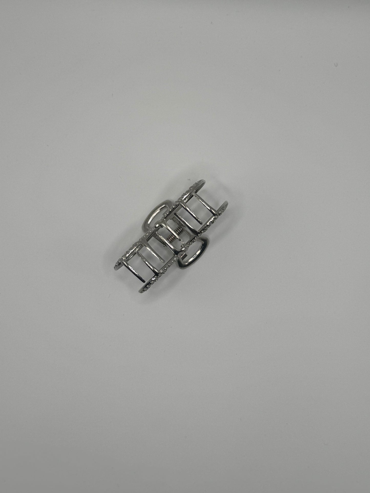 PINZA GRANDE A FORMA DI FIOCCO ARGENTO